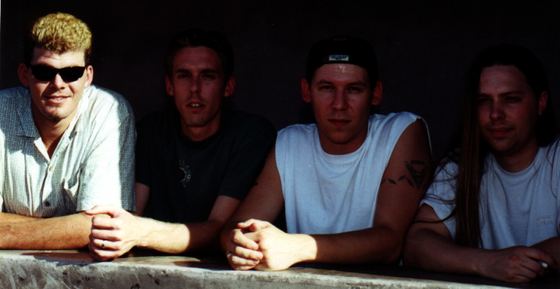 GROUNDED: band portrait, seated