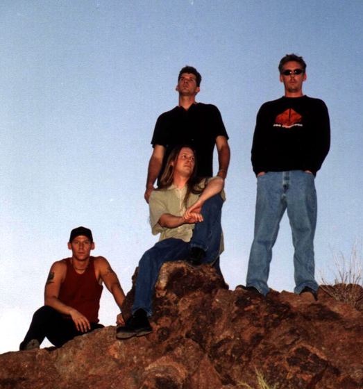 GROUNDED: on a desert rock against a blue sky