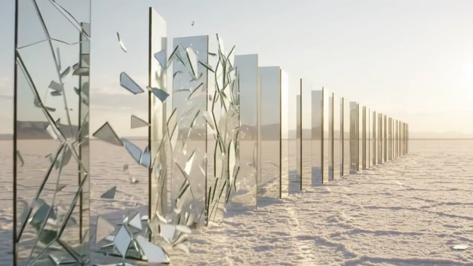 Glass panels shattering across a white salt flat